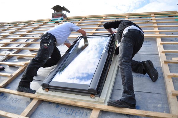 two-men-assembling-a-roof-skylight-window-2024-12-03-13-11-27-utc